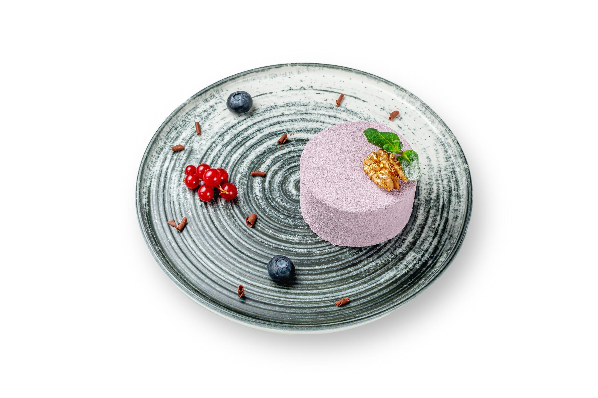 Large editorial shot of plated dessert on textured plate